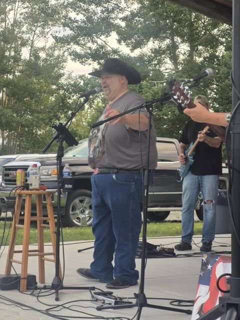 Mid-song and mid-grin